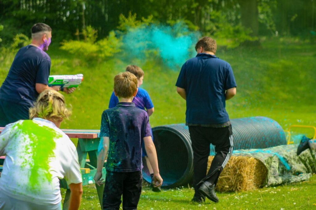 pupils running the colour run assault course
